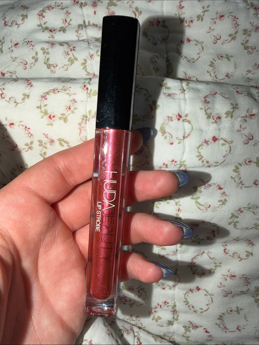 HUDA BEAUTY Lip Strobe Shimmer Lip Gloss — Rosey Copper